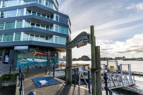 a hotel sign in front of a building at Victoria Regent Waterfront Hotel & Suites in Victoria