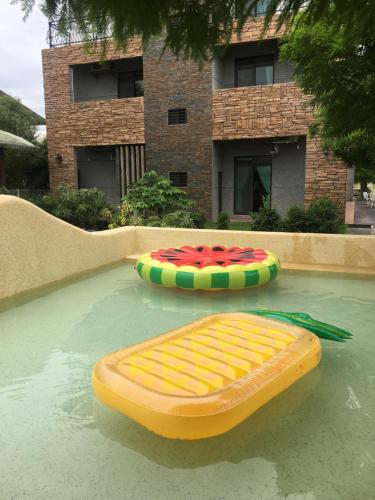 two infogie boards sitting on top of a swimming pool at Muho B&B in Dongshan