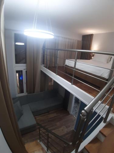 a room with two bunk beds and a light at Bistrica Hotel in Sarandë