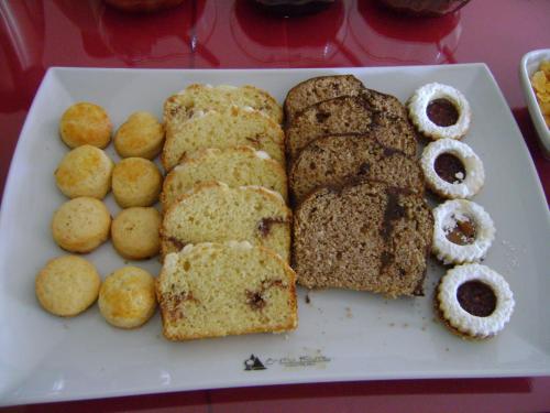 a plate of pastries and donuts on a table at Hostería Antu Kuyen in San Carlos de Bariloche