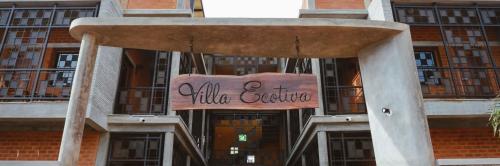 a building with a sign in front of it at Villa Ecotiva in Puducherry