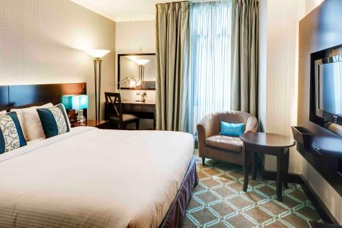 Un ou plusieurs lits dans un hébergement de l'établissement Novel Hotel City Center