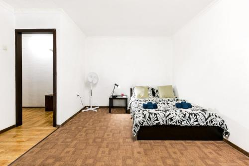 Säng eller sängar i ett rum på Apartment Tsaritsyno