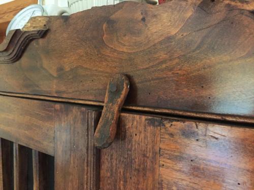 a wooden table with a wooden handle on it at Pfarrhof Stuer in Stuer