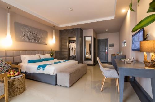 Ένα ή περισσότερα κρεβάτια σε δωμάτιο στο Damrei Angkor Hotel