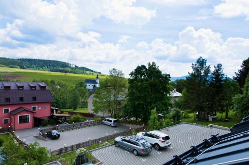 an aerial view of a parking lot with cars parked at Apartmány Dolní Morava in Dolní Morava