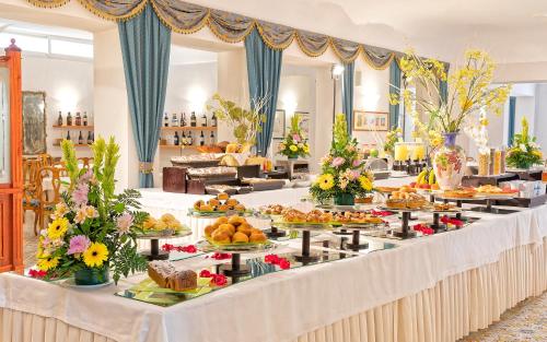 a large table filled with lots of different types of food at Hotel La Reginella Resort & Spa in Ischia