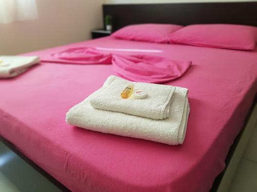 Ein Bett oder Betten in einem Zimmer der Unterkunft Aparthotel Vila Tufi