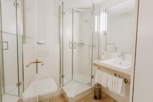Ванна кімната в Huber's Hotel