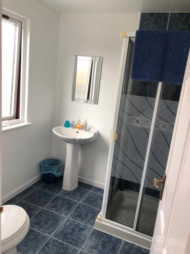 a bathroom with a shower and a sink at Fairwinds in Inverness