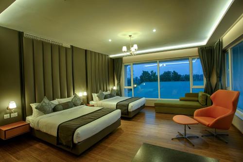 Postel nebo postele na pokoji v ubytování Four Vedas Hotel & Resort