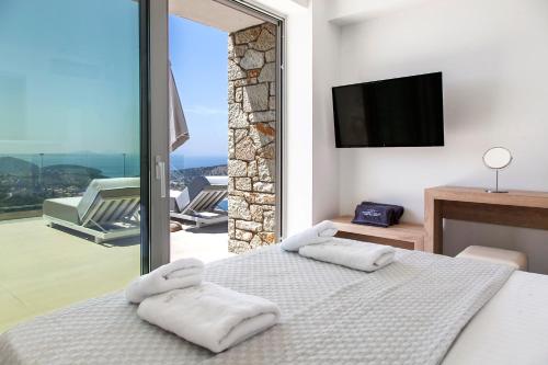 Posteľ alebo postele v izbe v ubytovaní SIVOTA SUNSET VILLAS
