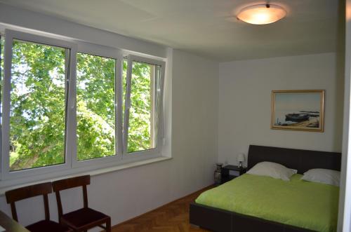 Posteľ alebo postele v izbe v ubytovaní Apartment Roxy