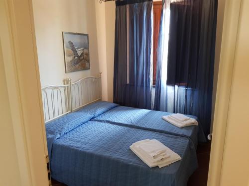 Posteľ alebo postele v izbe v ubytovaní Villaggio Turistico Airone