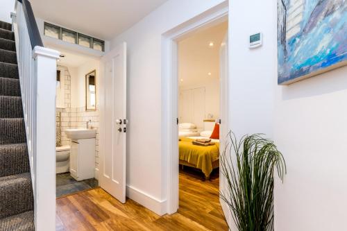 a hallway with a bathroom and a bedroom at City Apartments - Priory Street in York