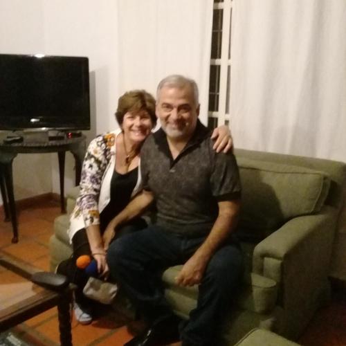 a man and a woman sitting on a couch at La Providencia in Yerba Buena