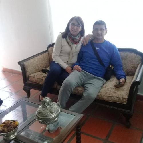 a man and a woman sitting on a couch at La Providencia in Yerba Buena