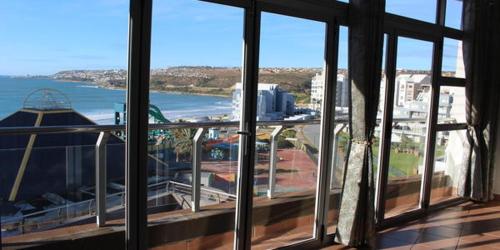 a view of a balcony with a view of the water at Vista Bonita Apartments in Mossel Bay