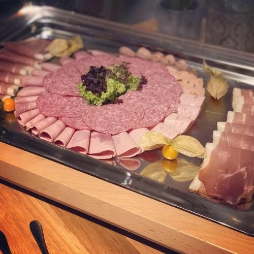 a tray of different types of meats and cheese at Landgasthof Rebstock in Ottenhöfen