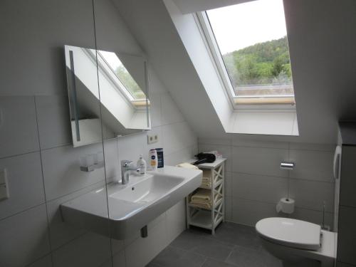 a bathroom with a sink and a window at Feriendomizil Taupadel in Bürgel