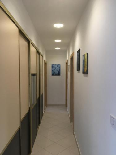 a hallway in a hospital with paintings on the walls at THE VIEW **** in Račišće