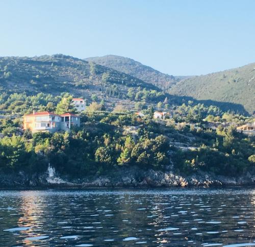 a house on a hill next to the water at THE VIEW **** in Račišće
