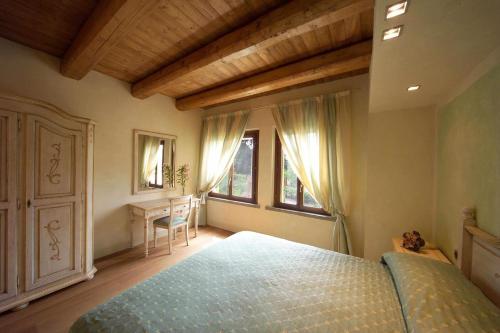 En eller flere senge i et værelse på Agriturismo I Leprotti