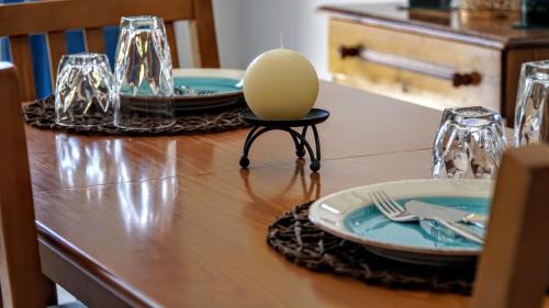 a wooden table with aegg on a table with plates at Irene Double Apartment Katoi in Symi