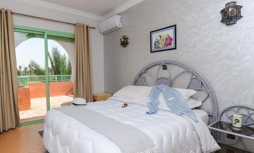 Postel nebo postele na pokoji v ubytování In Club Palmeraie Resorts