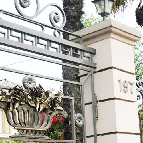 a building with a vase with flowers on it at Kobuleti VILLA SKAZOCNI DVORIK VIP in K'obulet'i