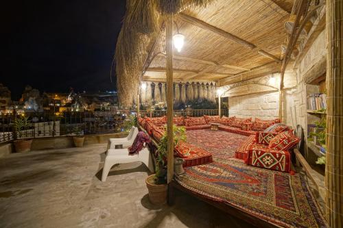 a large room with couches and a table at Panoramic Cave Hotel in Goreme