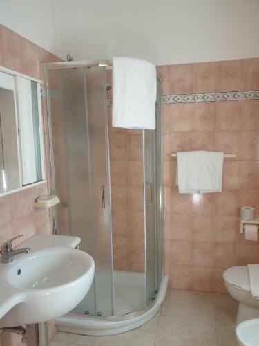 a bathroom with a shower and a sink at Hotel La Valle in Carloforte
