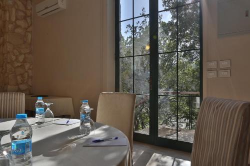 a table with two bottles of water on top of it at Mountain Breeze Lodge & Resort in Al Salt