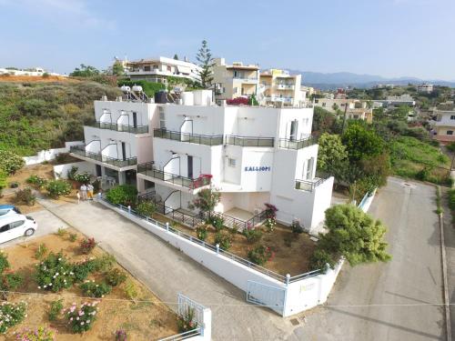 a small town with a large building at Kalliopi Studios - Apartments in Kato Daratso