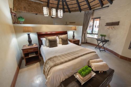 Voodi või voodid majutusasutuse Malilule Safaris toas
