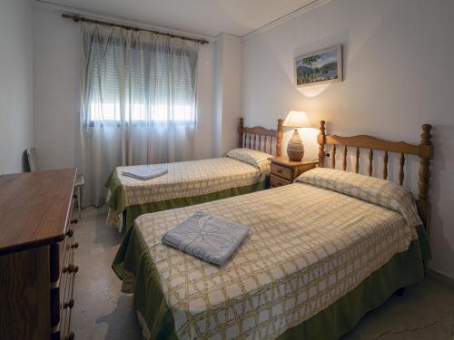 Posteľ alebo postele v izbe v ubytovaní Dorasal Solo Familias Serviplaya
