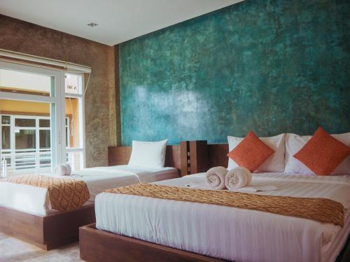 Postel nebo postele na pokoji v ubytování Silver Sands Resort - Koh Tao