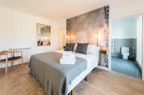 a hotel room with a bed and a table at Plaza de España Skyline in Madrid
