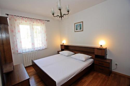 Postel nebo postele na pokoji v ubytování Apartment Igor