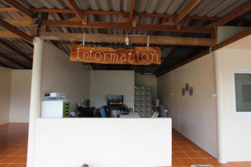 an office with a sign that reads information at Phi Phi Ba Kao Bay Resort in Phi Phi Don