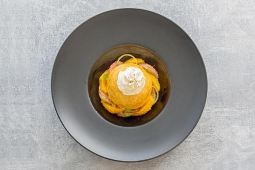 a bowl of food with ice cream on a plate at Mercure Chantilly Resort & Conventions in Chantilly