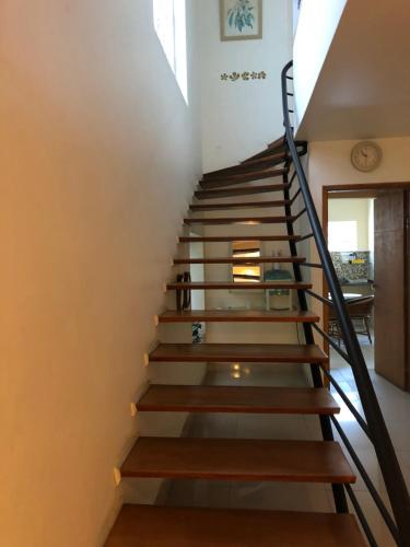 a staircase leading to the second floor of a house at Hostel Borba Gato in Sao Paulo