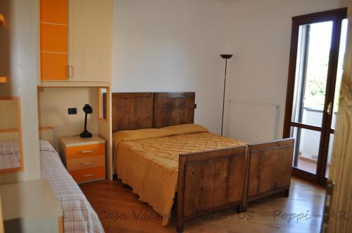 En eller flere senge i et værelse på Casa vacanze Boletus