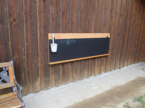 a wall with a cup on a fence at Haus Anna in Zandt