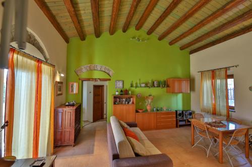 a living room with a couch and a table at Madonie Park Gates - Casa in C.Da Donalegge in Castellana Sicula