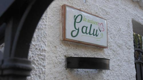 a sign for a restaurant on the side of a building at La Maison Galu' in Itri