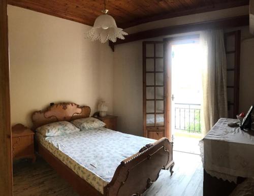 Postel nebo postele na pokoji v ubytování Dimitris House