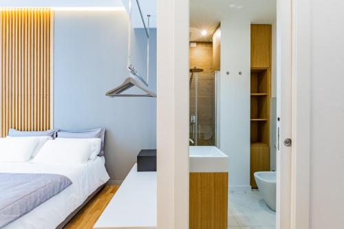 a bedroom with a bed and a shower and a sink at Concept Terrace Hotel in Rome