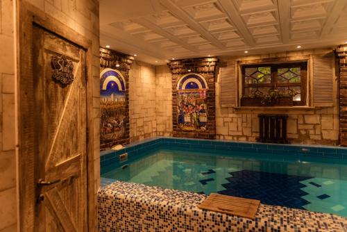 a swimming pool in a house with a room with at Rassl Country Home in Rostov on Don
