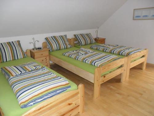 Postel nebo postele na pokoji v ubytování Ferienwohnung Haus Kloosterman